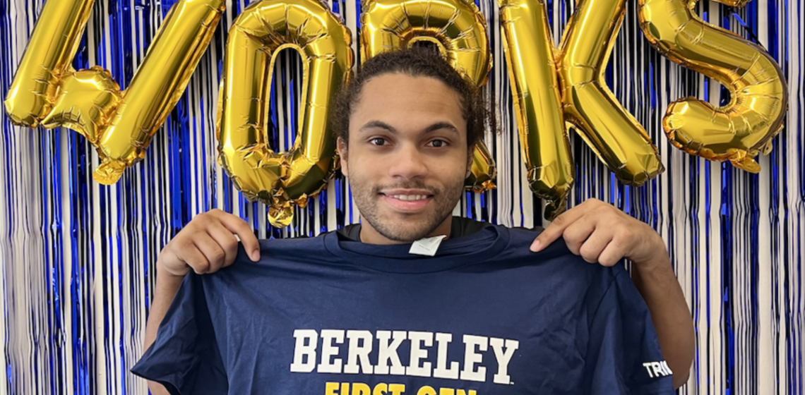 TRIO Student Support Services Scholar poses with Berkeley First-Gen t-shirt at National TRIO Day event.